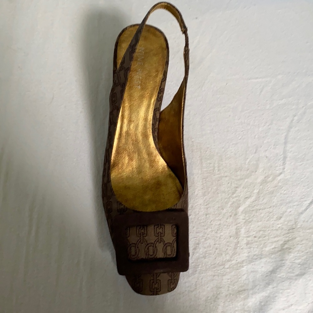 Brown slides with back strap.
